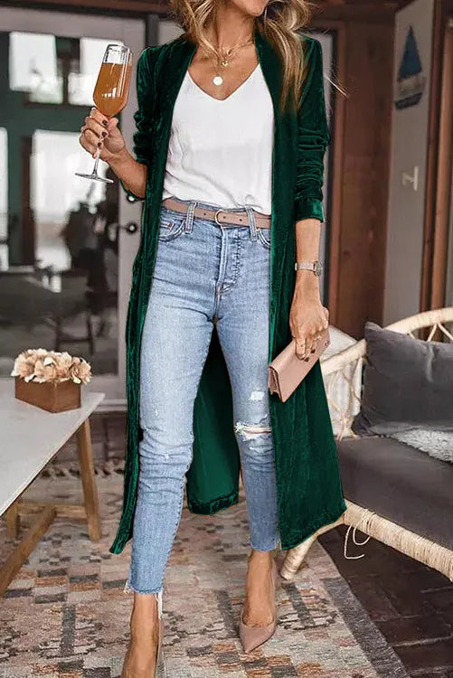 Luxurious velvet duster cardigan in a rich emerald green. Perfect for the holidays!